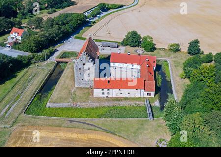 Aerial view over Glimmingehus, medieval castle at Simrishamn Municipality, Scania / Skåne in southern Sweden in summer Stock Photo