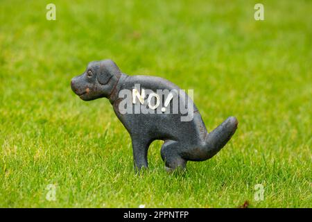 Dog Pooping Sign on Lawn Sign Stock Photo