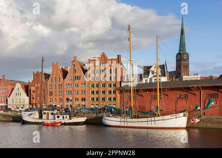 Museum harbour / Museumshafen Lübeck and traditional sailing ships berthed at the Untertrave in the Hanseatic town Lübeck, Schleswig-Holstein, Germany Stock Photo