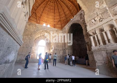 Tourists at the Old Umayyad Palace ruins, Amman Citadel, in Jordan. Interior view. A preserved building at Jabal al-Qal'a, a national historic site Stock Photo