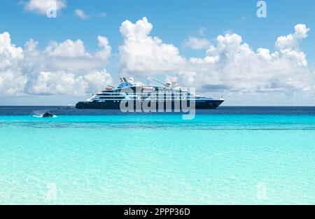 ASSUMPTION ISLAND, SEYCHELLES - MARCH 30, 2023: Expedition Cruise Ship Jacques Cartier of Ponant Cruises anchored at Assumption Island, Seychelles. Stock Photo