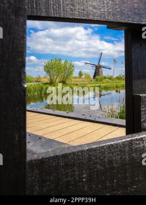 The windmills at Kinderdijk are a group of 19 monumental windmills in the Alblasserwaard polder, in the province of South Holland, Netherlands. Stock Photo