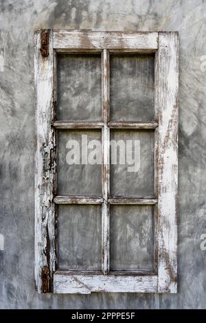 Old wooden frame from a window on a plastered wall, close-up Stock Photo