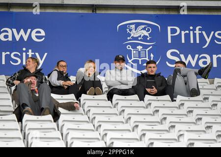 Swansea, Wales. 24 April 2023. Swansea City fans during the Professional Development League game between Swansea City Under 21 and Sheffield United Under 21 at the Swansea.com Stadium in Swansea, Wales, UK on 24 April 2023. Credit: Duncan Thomas/Majestic Media/Alamy Live News. Stock Photo