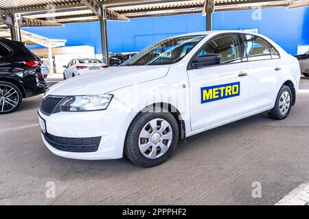 Samara, Russia - April 20, 2023: Branded Metro store vehicle. Metro store service logotype on a car. Delivery products, foods Stock Photo