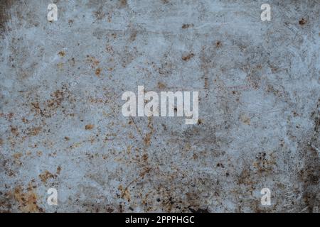 Grunge gray metal background or texture with scratches and cracks, close up, top view Stock Photo