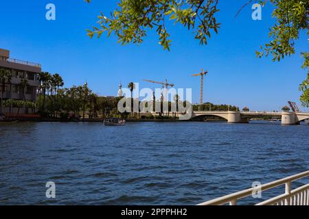 construction site with a crane on a blue sky background on a sunny day Stock Photo