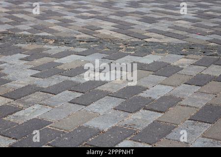 Background in the form of motley gray concrete tiles of a rectangular shape. Stock Photo