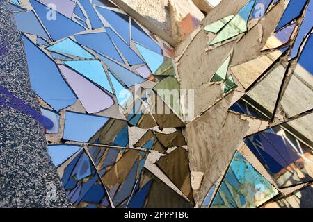 Wall art made of blue mirror shards reflecting the sky. Stock Photo