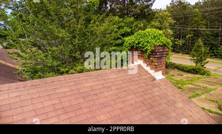 Chimney damaged and in need on maintenance and repair Stock Photo