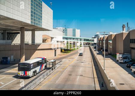 Bus stands at a bus stop at George Bush Intercontinental Airport in Houston, Texas, USA. Stock Photo