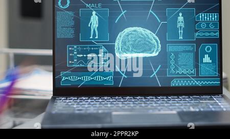 Laptop showing tomography scan at desk, empty hospital reception ...