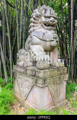 Stone male guardian lion statue in Gardens by the Bay, Singapore Stock Photo