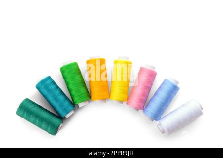 Composition with different thread spools on white background Stock Photo