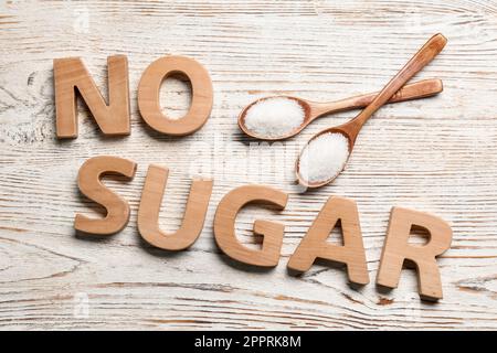 Flat lay composition with phrase No Sugar on white wooden table Stock Photo
