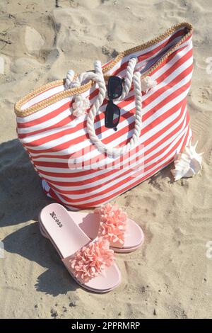 Stylish Striped Bag Slippers Seashell Sandy Beach Sea Stock Photo by  ©NewAfrica 616479018