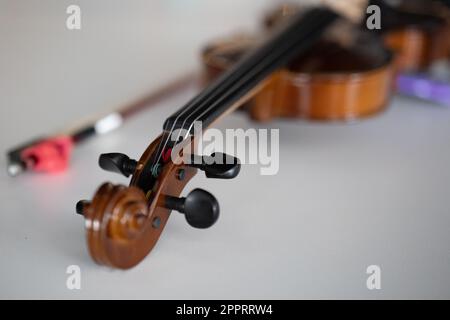 Violin lying on the table Stock Photo