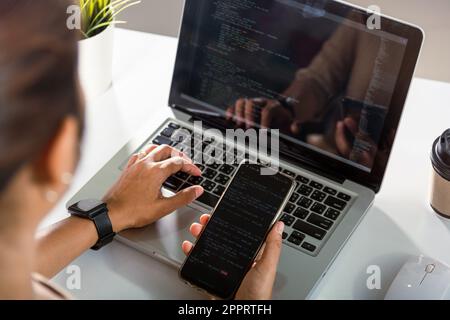 Software developer hands typing data coding programming javascript with laptop computer Stock Photo