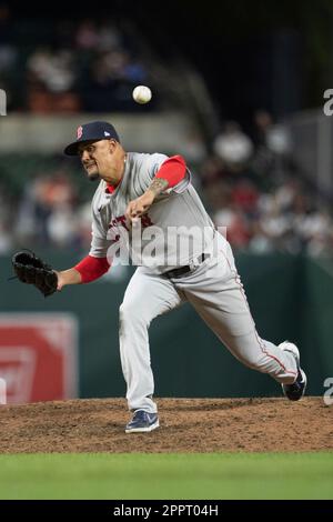 BALTIMORE, MD - APRIL 24: Boston Red Sox shortstop Enrique Hernandez (5)  attempts to throw a runner out at first base during the Boston Red Sox  versus the Baltimore Orioles on April