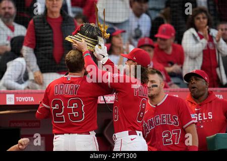 Brett Phillips (L) places a samurai warrior helmet on Los Angeles