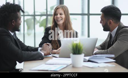 Team of interns and teacher studying marketing, working on startup project together. Stock Photo