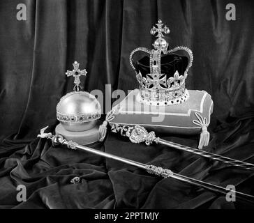 File photo dated 25/11/52 of St Edward's Crown, The Orb, The Sceptre with Cross (also known as the Royal Sceptre), The Scepture with Dove and The Sovereign's Ring (foreground). The priceless Crown Jewels - the nation's most precious treasures - will play a starring role at the coronation of King Charles III. Issue date: Tuesday April 25, 2023. Stock Photo