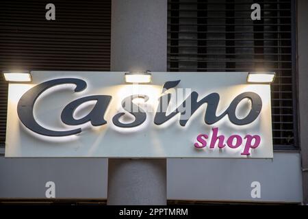lyon , Aura France - 04 20 2023 : Casino shop supermarket logo brand and text pink sign front facade chain market store city entrance french retailer Stock Photo