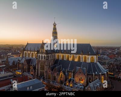 The Grote Kerk or St.-Bavokerk is a Reformed Protestant church and former Catholic cathedral located on the central market square (Grote Markt) in the Stock Photo