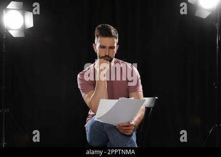 Professional actor reading his script during rehearsal in theatre Stock ...