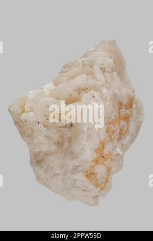 Close up detail textured white Algerian chalcopyrite on dolomite stone on gray background Stock Photo