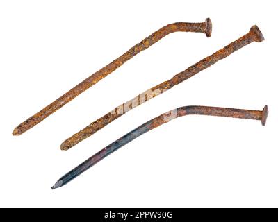 Old used and deformed nails, rusted and oxidized close-up, isolated on a white background Stock Photo