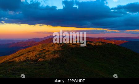 The beautiful Mount Feathertop during vibrant orange sunset in Australia Stock Photo