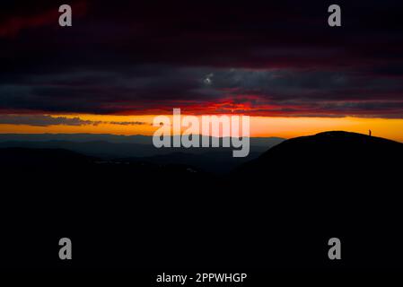 The beautiful Mount Feathertop during vibrant orange sunset in Australia Stock Photo