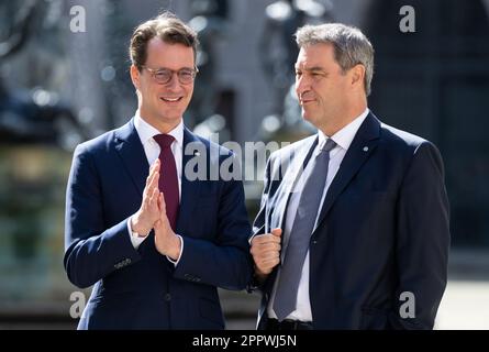 Munich, Germany. 25th Apr, 2023. Markus Söder (CSU, r), Prime Minister of Bavaria, greets Hendrik Wüst (CDU), Prime Minister of North Rhine-Westphalia, before a joint cabinet meeting of the two states. Credit: Sven Hoppe/dpa/Alamy Live News Stock Photo