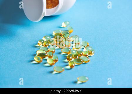 Oil filled capsules (softgel) of food supplements: fish oil, omega 3, omega 6, omega 9, vitamin A, vitamin D3, vitamin E, evening primrose oil, borage Stock Photo