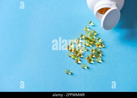 Oil filled capsules (softgel) of food supplements: fish oil, omega 3, omega 6, omega 9, vitamin A, vitamin D3, vitamin E, evening primrose oil, borage Stock Photo