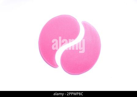 Hydrogel pink eye patches isolated on white background. Cosmetic moisturizing under eye patches or pads with collagen. Stock Photo