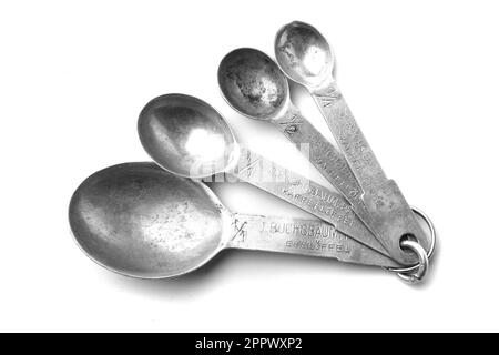 old aluminum spoon set isolated on the white background Stock Photo