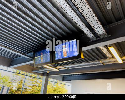 Basel, Switzerland - Sep 22, 2022: The modern digital display monitor at of EuroAirport Basel-Mulhouse-Freiburg displays a list of international fligh Stock Photo