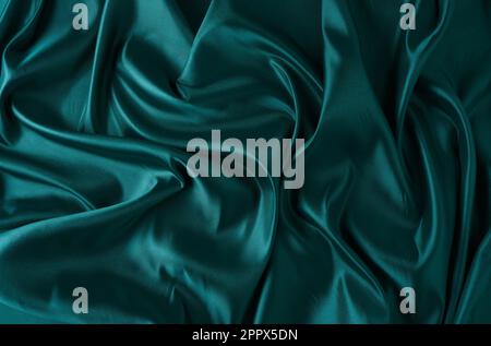 Silk fabric, abstract wavy green satin fabric background Stock Photo