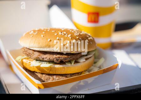 Big Mac close up with paper cup McDonalds Coca Cola, eating fast food in McDonalds Restaurant 23.03.20 Kemer Turkey Stock Photo