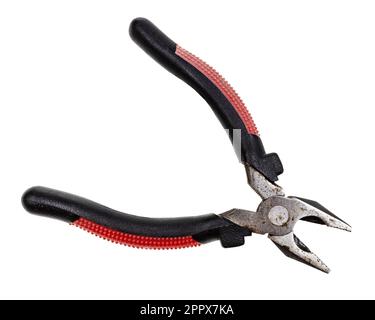open old pliers with red and black rubber handle isolated on white background Stock Photo
