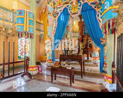 Interior of the Cao Dai temple in Hoi An, Quang Nam province, Vietnam. Cao Dai is a monotheistic syncretic religion that retains many Vietnamese folk Stock Photo