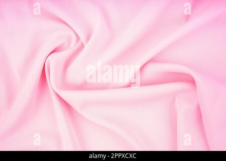 Pink color cloth waves background texture. Stock Photo