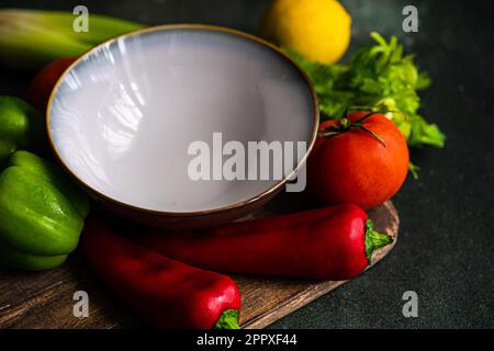 From above healthy vegetable salad ingredients on concrete table ready for cooking Stock Photo