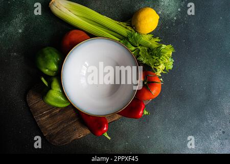 Top view of a healthy vegetable salad ingredients on concrete table ready for cooking Stock Photo