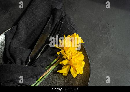 Top view of minimalistic table setting with tableware and cutlery on concrete background Stock Photo