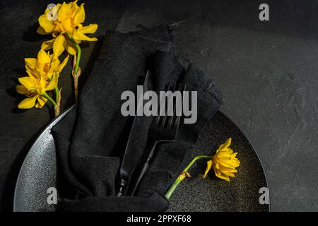 Top view of minimalistic table setting with tableware and cutlery on concrete background Stock Photo