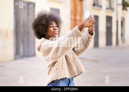 Excited African American Bushy Woman Looking At Camera Over Pink Background  Stock Photo  Alamy