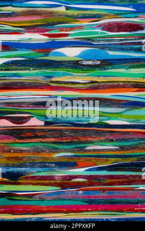 Resin from the process of surfboard making. Lots of layers that take a lot of time and work to build up. Each color is a different surfboard that was Stock Photo